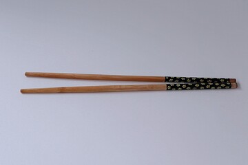 Bamboo chopsticks on white background
