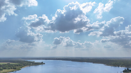 Serene Sky and Clouds Over Mazurian Lake with Calm Water Reflection – A Peaceful Nature Scene