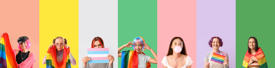 Group of young LGBT women with flags on color background