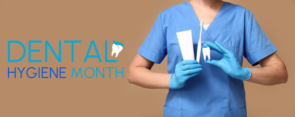 Female dentist with toothbrush, toothpaste and tooth model on beige background