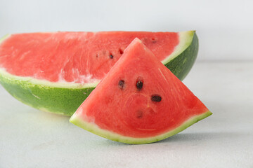 Piece of ripe watermelon on light background, closeup