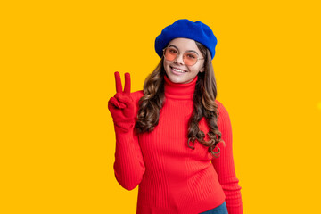 Trendy and stylish teenager girl smiling. Fall fashion style for teen. Complete outfit for the fall style. Girl in autumn beret. Teen girl isolated in yellow. Autumn fashion girl. Statement outerwear
