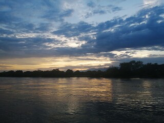 landscape of a river and trees at dusk