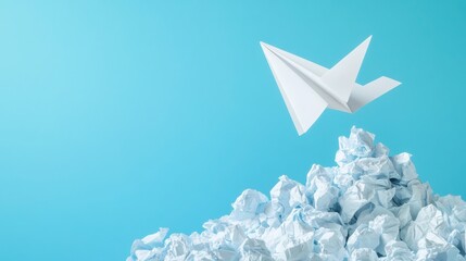 Creative flight, a paper airplane soars above a mountain of crumpled paper, representing the journey of brainstorming, set against a calming light blue backdrop