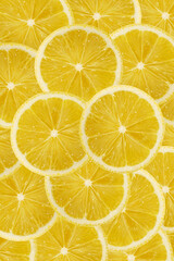 Yellow lemon slices texture background. fruit pattern concept.