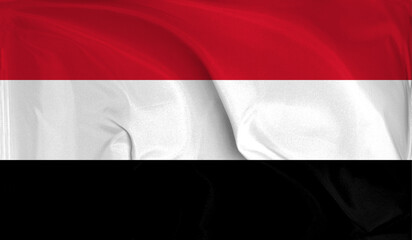 An up close view of Yemen flag flying textures