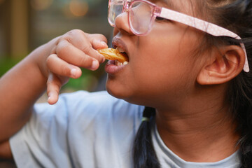  child eating french fries close up 