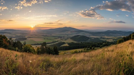Scenic Sunset View Over Rolling Hills.
