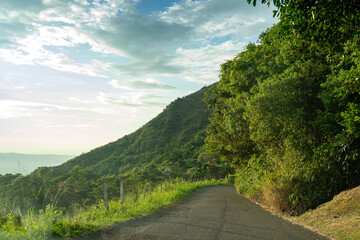 Secondary rural road between mountains in tropical area