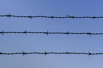 Close-up view of fencing that is made of steel wire. A device that prevents the entry of strangers...