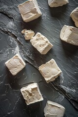 White Cubes on Slate Surface.