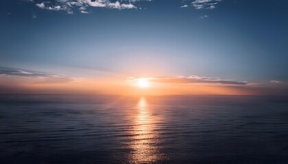 Obraz premium new beginning concept Beautiful orange sunset over the ocean. Reflected on the calm waters with a few clouds in the sky.