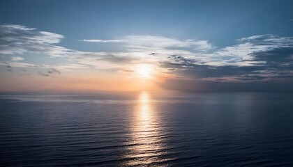 Obraz premium new beginning concept Beautiful orange sunset over the ocean. Reflected on the calm waters with a few clouds in the sky.