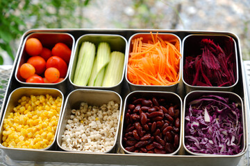 Salad bar tray with topping.