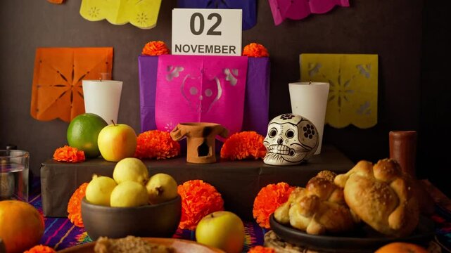 A wind blows out the candles on the Day of the Dead altar, ofrenda dia de muertos in mexico