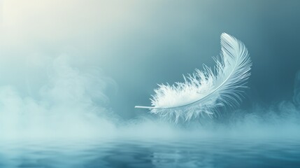 Single white feather floating in a misty blue background, creating a sense of tranquility and peace.