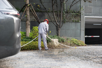 A tended garden, workers maintaining the garden,resort design,resort and garden landscaping