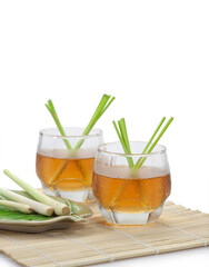 Cold lemongrass tea on white background..