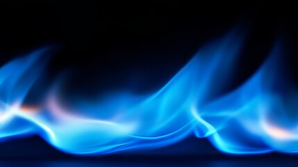 A vivid blue flame dances upward in a closeup captured against a black background, highlighting its soft curves and enchanting flickers of light