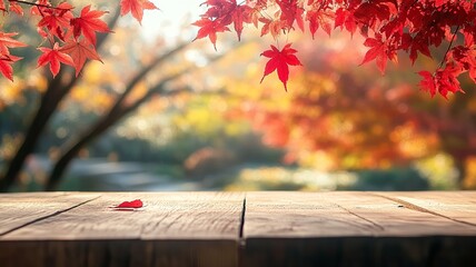 Empty wood table top and blurred autumn tree and red leaf background - can used for display or montage your products