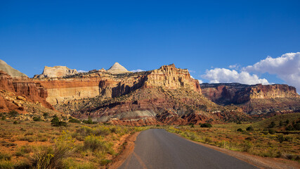 Capitol reef national park landscape, red rock mountain peaks, tall sedimentary rock formations