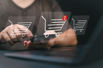business ecommerce concept, online purchase, ecommerce store, online business, shopping on the internet. Person use smartphone and laptop with online shopping cart icon on virtual screen.