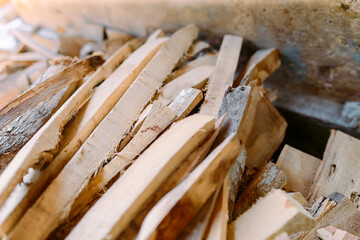 Pile of wood logs for build Furniture production,sew natural wood scraps.