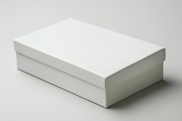 Naklejka premium White Cardboard Box on a White Surface