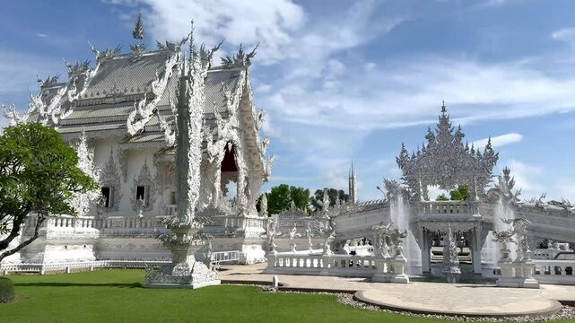 Footage of White temple at Chiang Rai, Thailand, or Wat Rong Khun in Thai. White temple with its authentic Buddhist ornaments and engraving covered in all white paint.