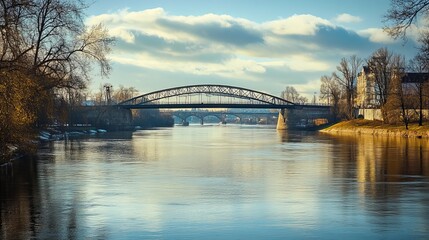 Fototapeta premium Cracow, Poland: View of the Józef Piłsudski road bridge spanning the Vistula River, featuring an arch-shaped steel structure. Focused detail.