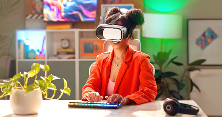 Happy woman, vr and gamer with keyboard for simulation, virtual vision or futuristic experience at home. Young, female person or player with smile for metaverse, ai technology or 3D gaming software © HockleyM3/peopleimages.com