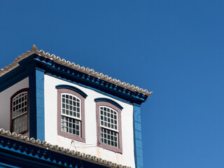 Traditional Blue and White Colonial Architecture Under Blue Sky
