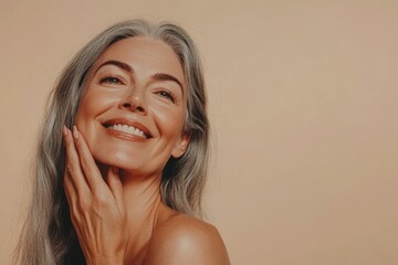 Portrait of a joyful mature woman with long gray hair and a radiant smile, exuding confidence and positivity on a soft neutral background. Generated AI