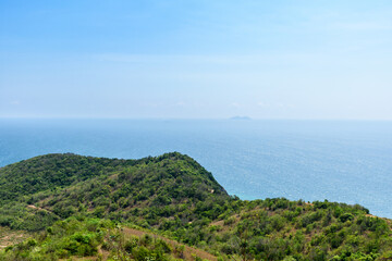 Fototapeta premium Landscape of beautiful mountains and blue sea on a clear sky background morning day at Koh Larn island. View point on mountain to see view of nature sea and sky. Panorama ocean. Pattaya, Thailand.