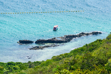 Landscape of blue sea with speedboat and mountain morning day at Koh Larn island. View point on...