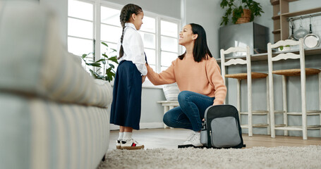 Backpack, dressing and mom with child in home getting ready for education, learning and classes. Family, morning routine and happy mother with girl prepare with tie, uniform and clothes for school