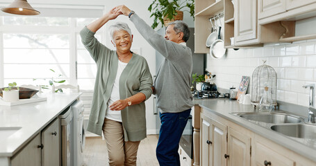 Elderly couple, dancing and love in home, support and holding hands for laughing in kitchen. People, commitment and together for connection in relationship, bonding and romance or loyalty in marriage