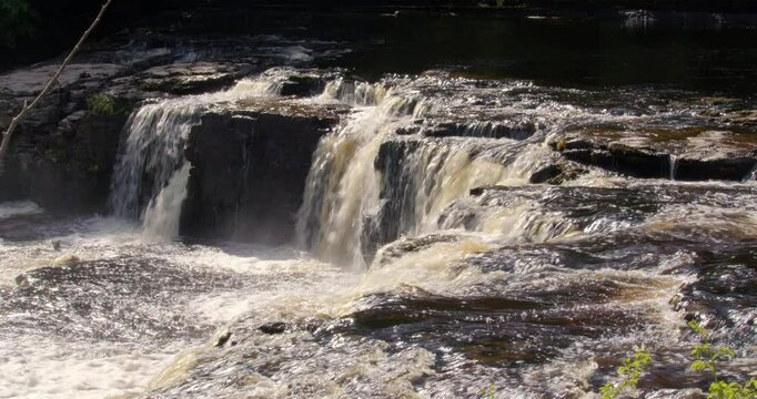 Mid side on shot of the upper falls at Aysgarth falls on the river ure, Yorkshire dales