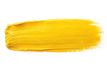 Thick yellow paint stroke showcasing texture and color depth on white background