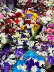 beautiful, bright bouquets of flowers in the shop, daytime. Floristry, increase in prices for flowers, painstaking work, season