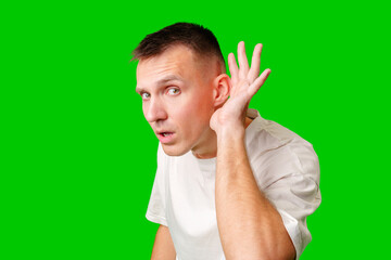 Curious Man Listening Intently Against Bright Green Background