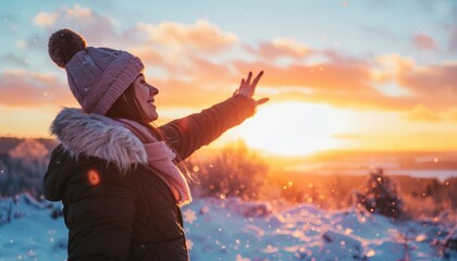 Embracing Freedom: Woman's Joyful Sunset Moment in Winter Nature