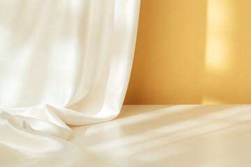 Soft White Fabric Draped Elegantly Against a Warm Yellow Wall in Natural Light