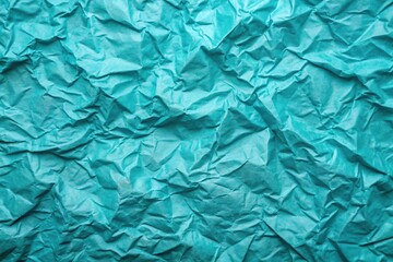 Obraz premium Turquoise crumpled paper texture background with abstract wrinkled wallpaper design