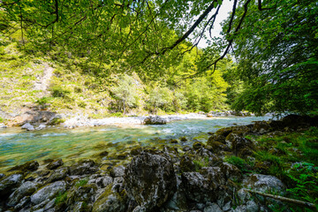 Nature in the Tiefenbachklamm between Kramsach and Brandenberg. Landscape with a river and rocks in the Alpbachtal.
