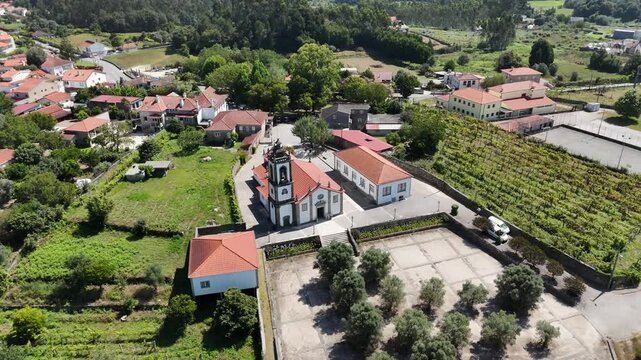 Aerial - Igreja Paroquial de Freixo, surrounded by rural houses and vineyards