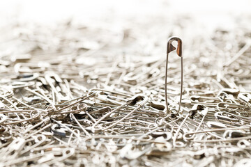 stainless safety pins. Selective focus.
