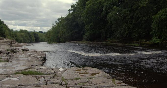 extra wide shot of the river ure going over the lower falls at Aysgarth falls, Yorkshire dales