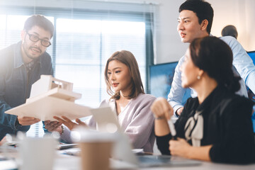 Asian business teamwork in a modern office planning and presenting ESG and technology innovations