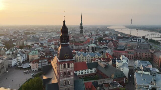 Aerial view of Riga Dome Cathedral, Daugava River, Vansu Bridge and historic city centre early in the morning at sunrise on a clear summer or autumn day, Latvia, Europe
